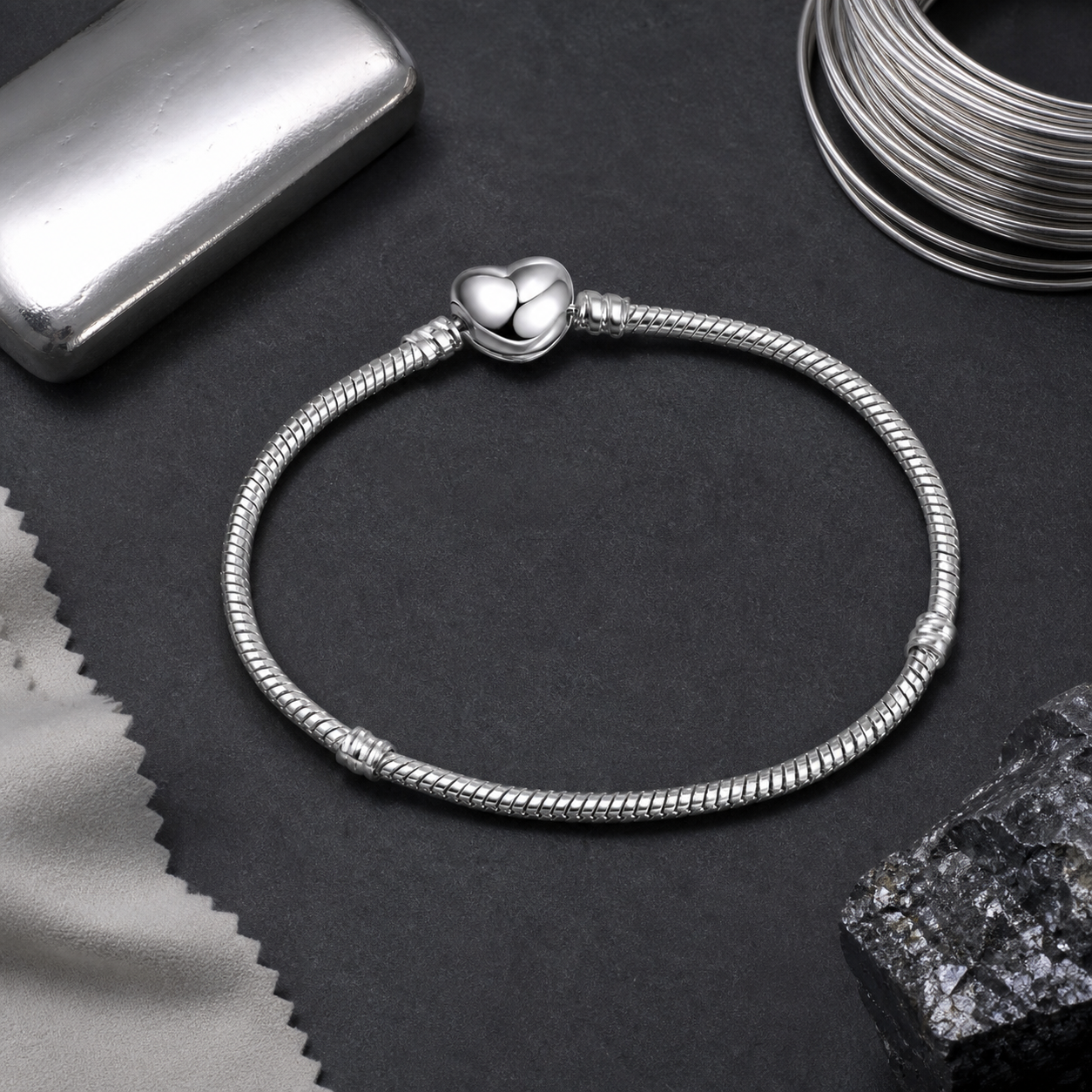Serpentine Charm Bracelet — sterling silver still life