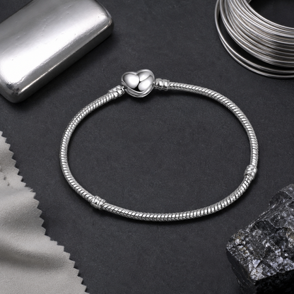 Serpentine Charm Bracelet — sterling silver still life